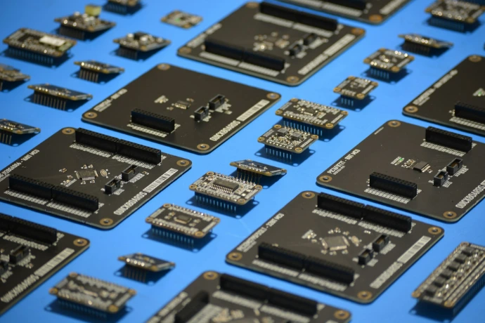 Several electronic circuit boards arranged on a blue surface